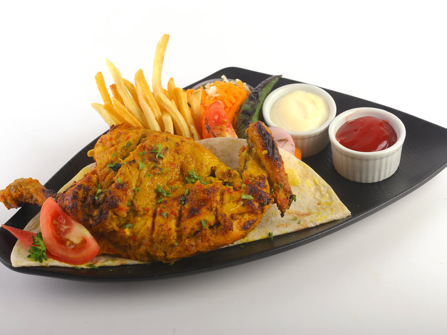 Charcoal grilled chicken with fries and garlic sauce