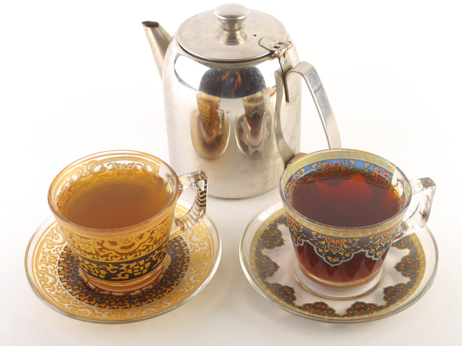 Moroccan green tea and black Arabic tea with a silver pot